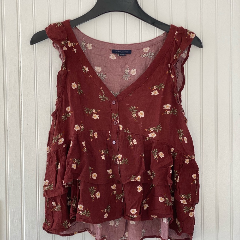 Maroon floral blouse with buttons in the center